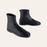 A pair of black leather boots with a side zipper, displayed on a light beige background.