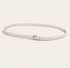Thin ivory belt with a gold buckle on a light beige background