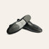A pair of black leather slip-on loafers with fringe detailing, shown from the side and bottom on a light beige background. The brand name 'A SOLARI' is visible on the insole.