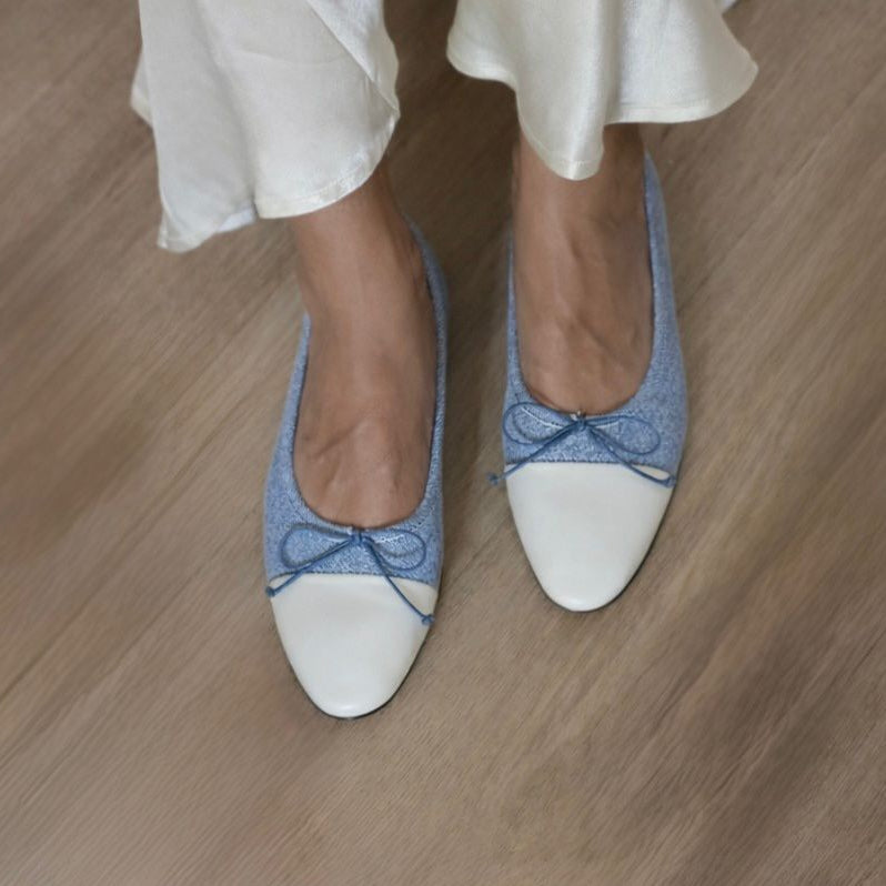 Blue and white shoes on a wooden floor